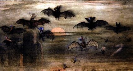 a group of bats flying over a field