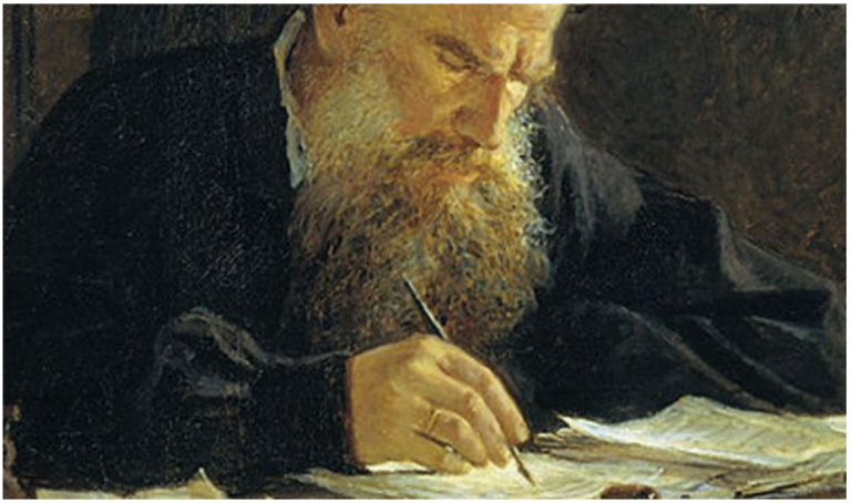 an old man with a long beard writing