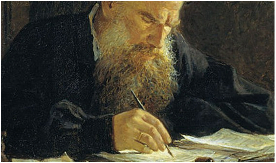 an old man with a long beard writing