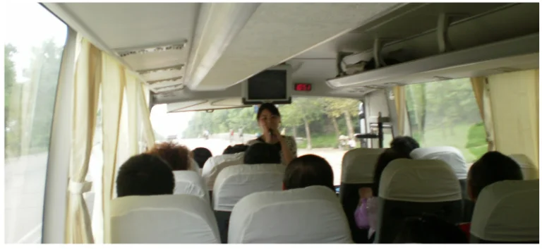 a group of people sitting on top of a bus