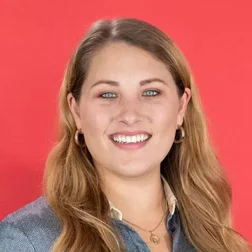 a woman with long blonde hair and blue eyes