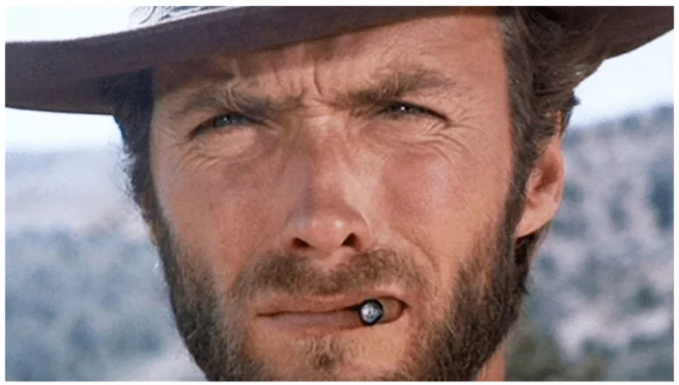 a man wearing a hat with a nose ring