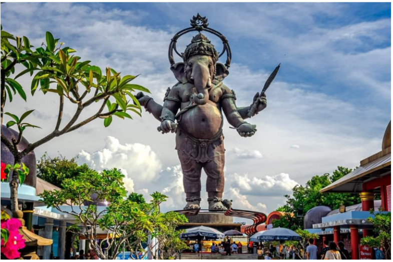 a statue of an indian god holding a sword