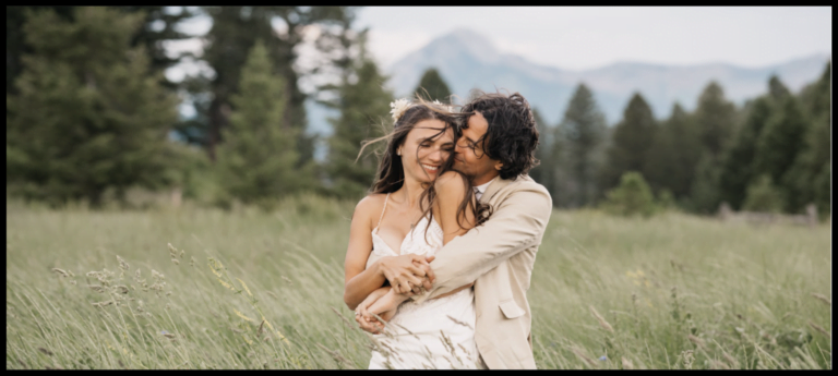 a man and woman embracing in a field