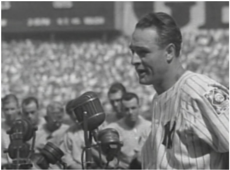 an old photo of a baseball player speaking into a microphone