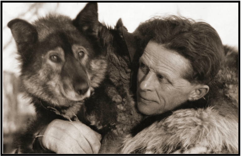 an old photo of a woman and a dog