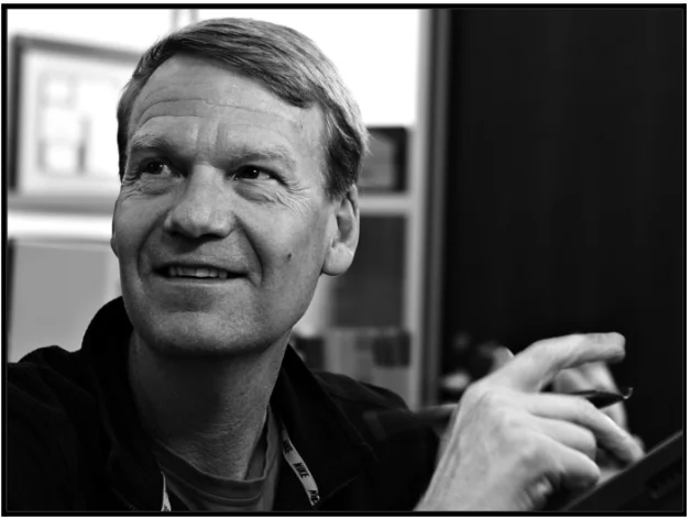 a black and white photo of a man holding a cigarette